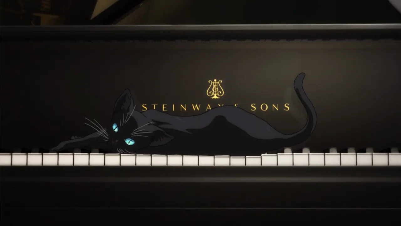 A cat lying on a piano