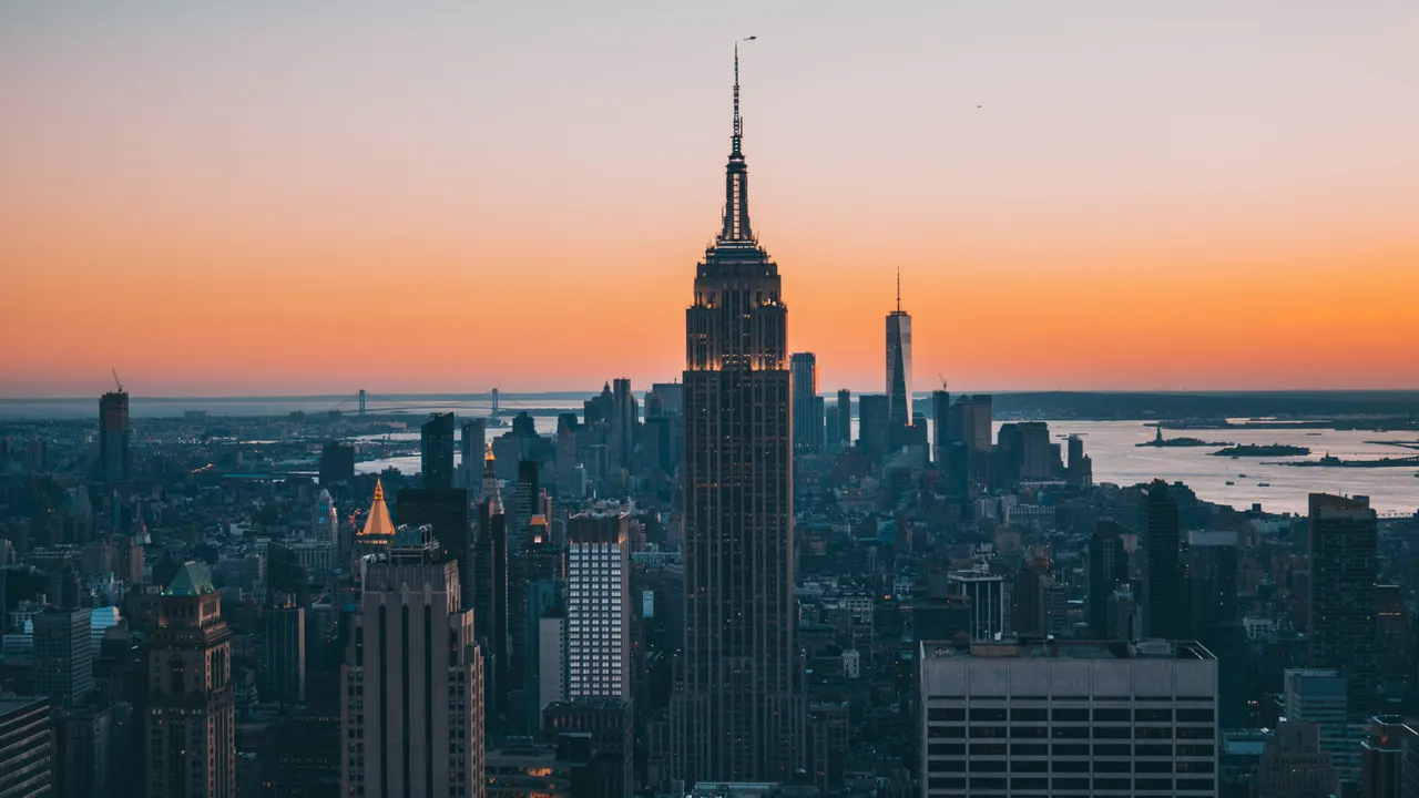 A city skyline with a tall building