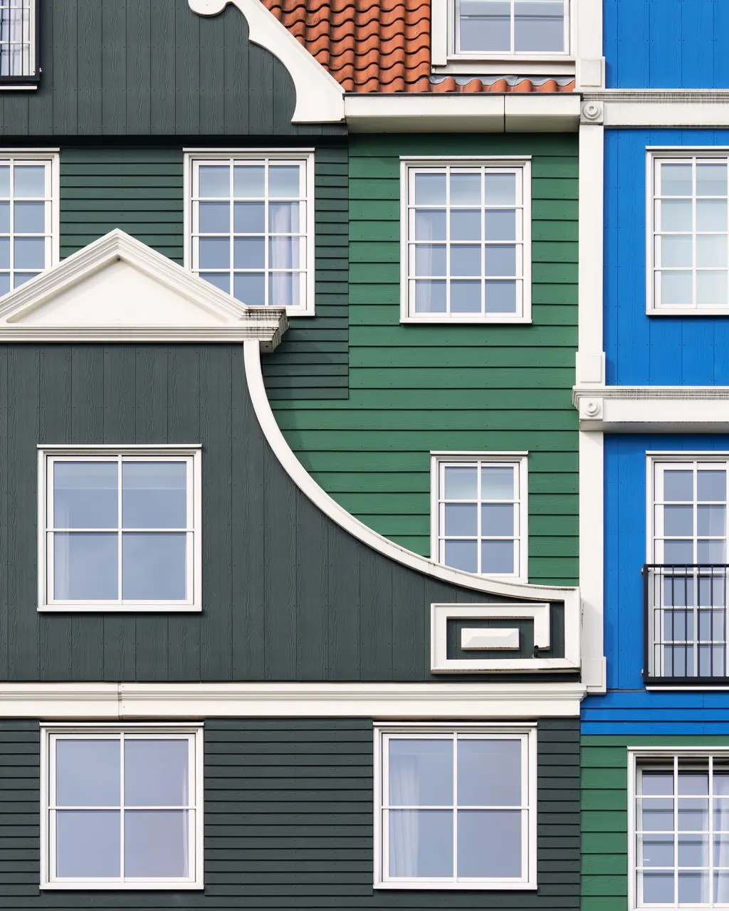 A multi colored building with many windows