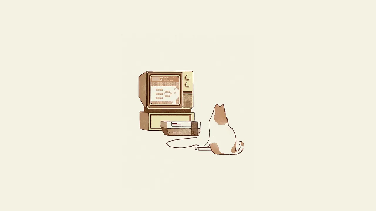 A cat sitting next to a computer