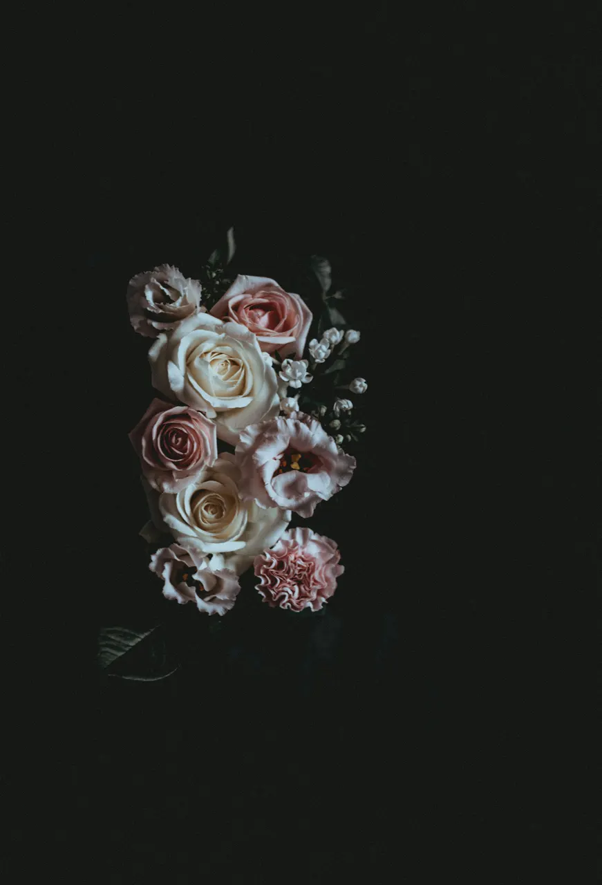 A bouquet of flowers on a black background