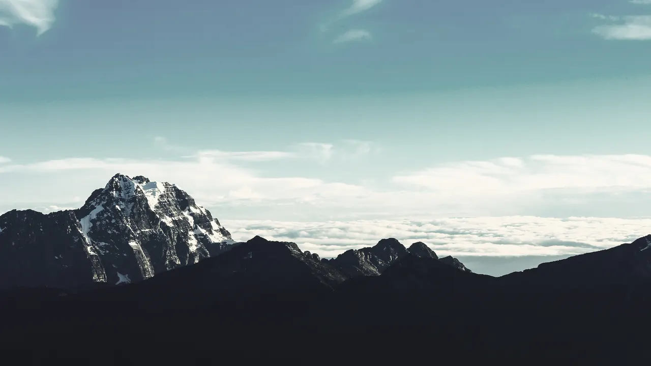 A mountain range with snow on top