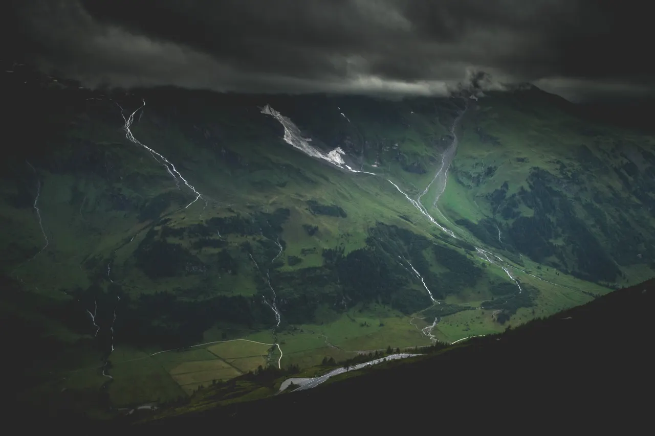 A mountain with a road going through it