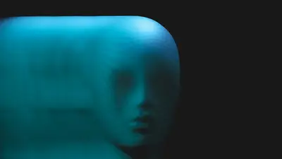 A face in a blue light