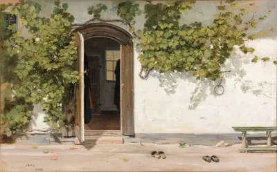 A door with a doorway and shoes on the ground