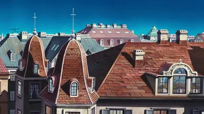 A group of rooftops with a cross on top