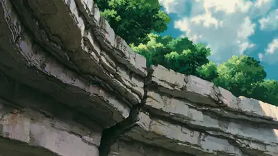 A rock cliff with trees on top