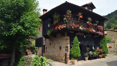 A building with flowers on the balcony