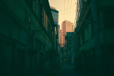 A city alley with buildings and power lines