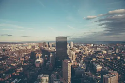 A city with tall buildings and water in the background