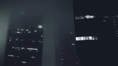 A group of buildings in the fog