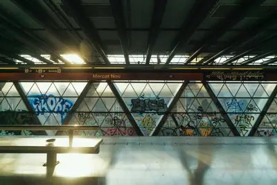 A room with a table and graffiti on the wall