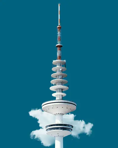 A white tower with a blue sky