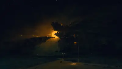 A road with a car in the middle of the road