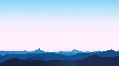 A blue and pink sky over a mountain range