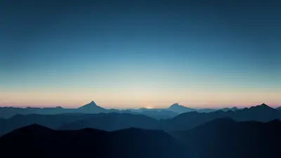 A landscape of mountains and a sunset