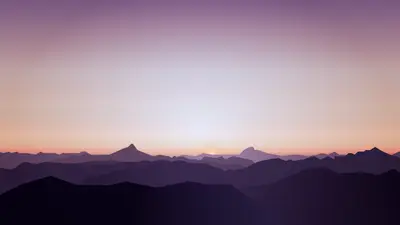 A landscape of mountains and a sunset