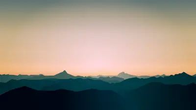 A landscape of mountains and a sunset