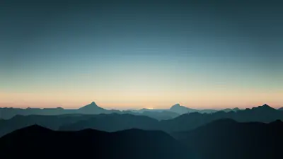 A landscape of mountains and a sunset