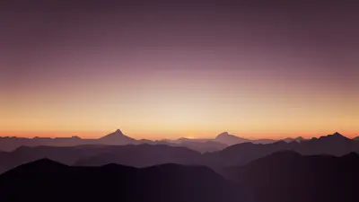 A sunset over a mountain range