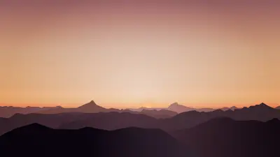 A sunset over a mountain range