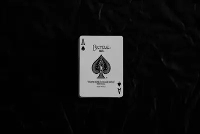 A card on a black surface