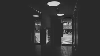 A hallway with lights on the ceiling