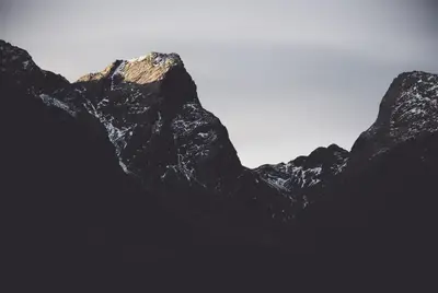 A mountain range with snow on top