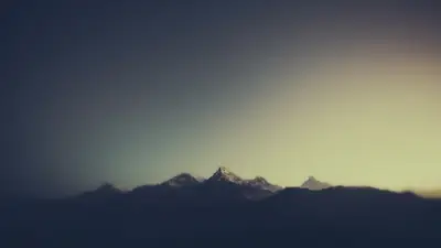 A mountain range with snow on top