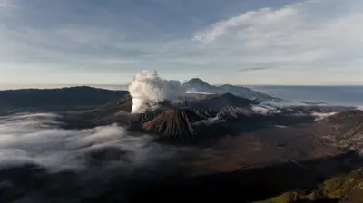 A mountain with smoke coming out of it