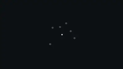 A black background with white dots and circles