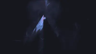 A triangle shaped object with a blue and white light