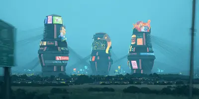 A group of tall buildings with cartoon characters on them