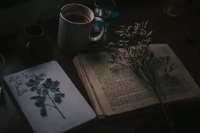 A book and coffee on a table